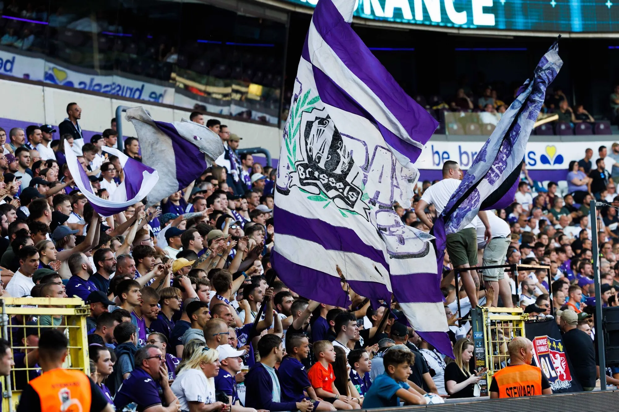 Anderlecht's supporters holding a big flag pictured during a friendly soccer match between RSC Anderlecht and Olympique Lyonnais, Saturday 16 July 2022 in Anderlecht, to prepare the 2022-2023 'Jupiler Pro League' first division of the Belgian championship. BELGA PHOTO KURT DESPLENTER 