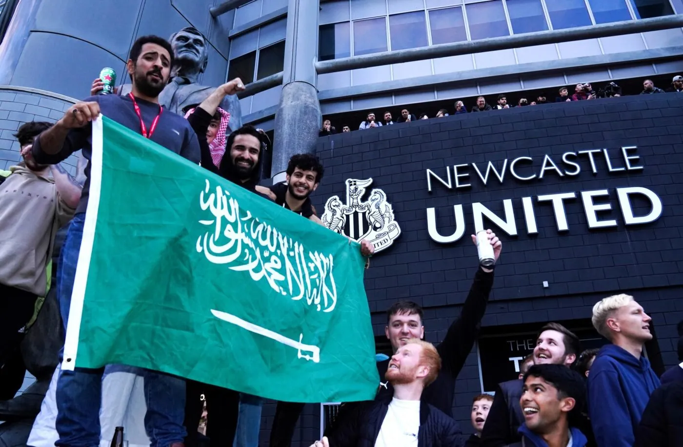 Newcastle United fans celebrate at St James' Park following the announcement that The Saudi-led takeover of Newcastle has been approved. Picture date: Thursday October 7, 2021. 