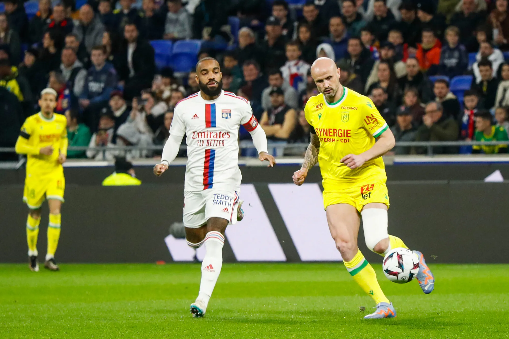 Nicolas PALLOIS of Nantes and Alexandre LACAZETTE of Lyon  during the Ligue 1 Uber Eats match between Lyon and Nantes at Groupama Stadium on March 17, 2023 in Lyon, France. (Photo by Romain Biard/Icon Sport)