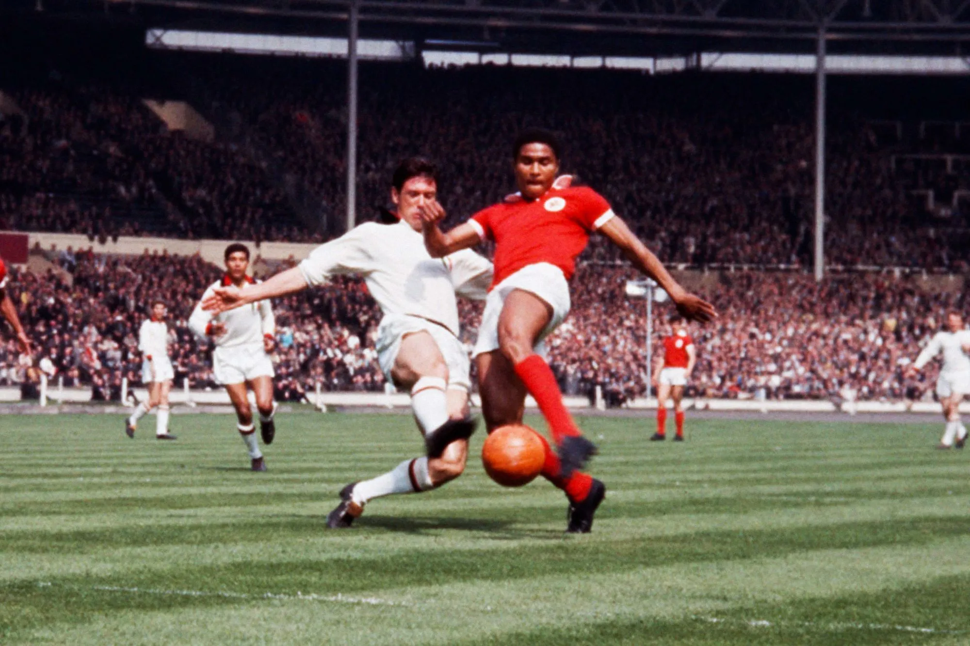 AC Milan's Cesare Maldini tackles Benfica's Eusebio during the European Cup Final match between Milan AC and Benfica on 22th May 1963