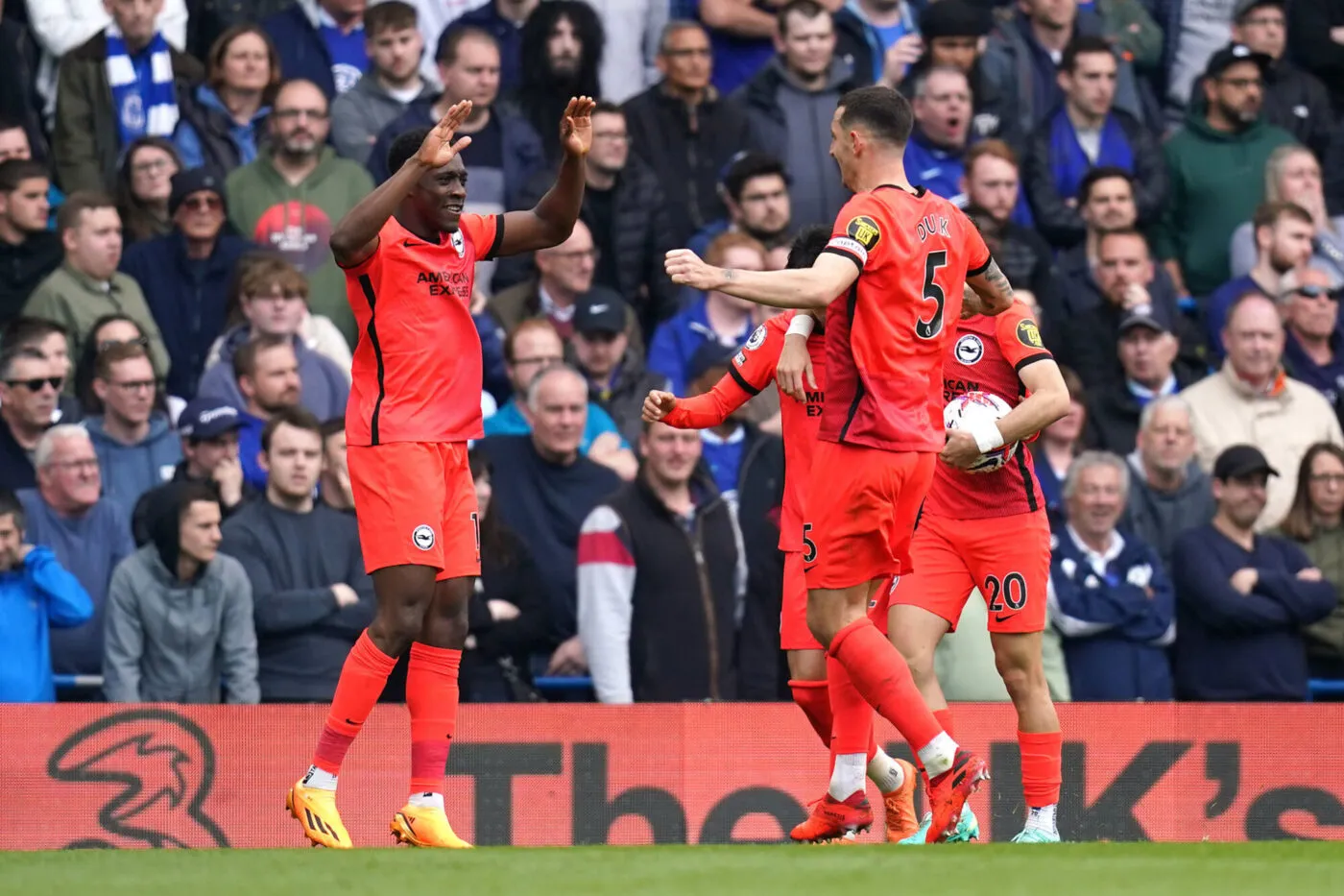 Brighton and Hove Albion's Danny Welbeck (left) celebrates scoring their side's first goal of the game with team-mates during the Premier League match at Stamford Bridge, London. Picture date: Saturday April 15, 2023. - Photo by Icon sport