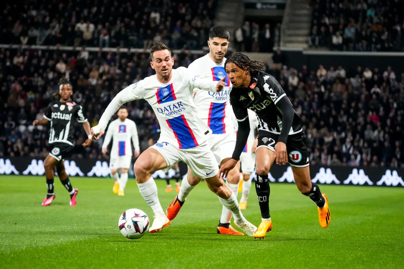 Fabian RUIZ of Paris Saint Germain (PSG) and Jean Matteo BAHOYA of Angers SCO during the Ligue 1 Uber Eats match between Angers and Paris on April 21, 2023 in Angers, France. (Photo by Hugo Pfeiffer/Icon Sport)