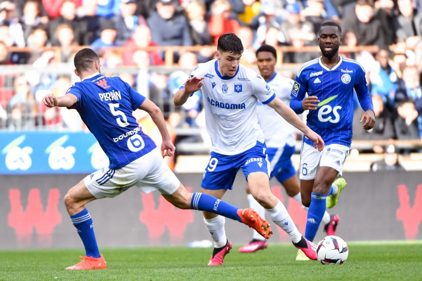Lucas PERRIN of Racing Club de Strasbourg,Jean Eudes AHOLOU of Racing Club de Strasbourg and Matthis ABLINE of Auxerre during the Ligue 1 Uber Eats match between Strasbourg and Auxerre at La Meinau Stadium on March 19, 2023 in Strasbourg, France. (Photo by Franco Arland/Icon Sport)