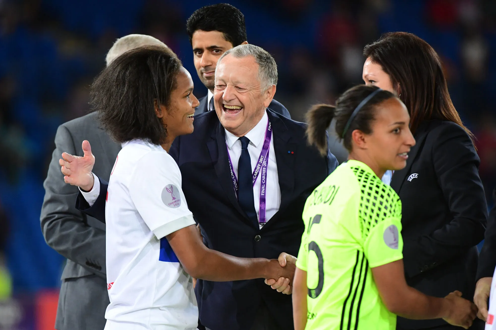 PSG President Nasser Al Khelaifi looks Lyon president Jean Michel Aulas celebrates with captain Wendie Renard of Lyon after their teams wins the final of the UEFA Women&rsquo;s Champions League match between Olympique Lyonnais and Paris Saint-Germain at Cardiff City Stadium on June 1, 2017 in Cardiff, Wales. (Photo by Dave Winter/Icon Sport)