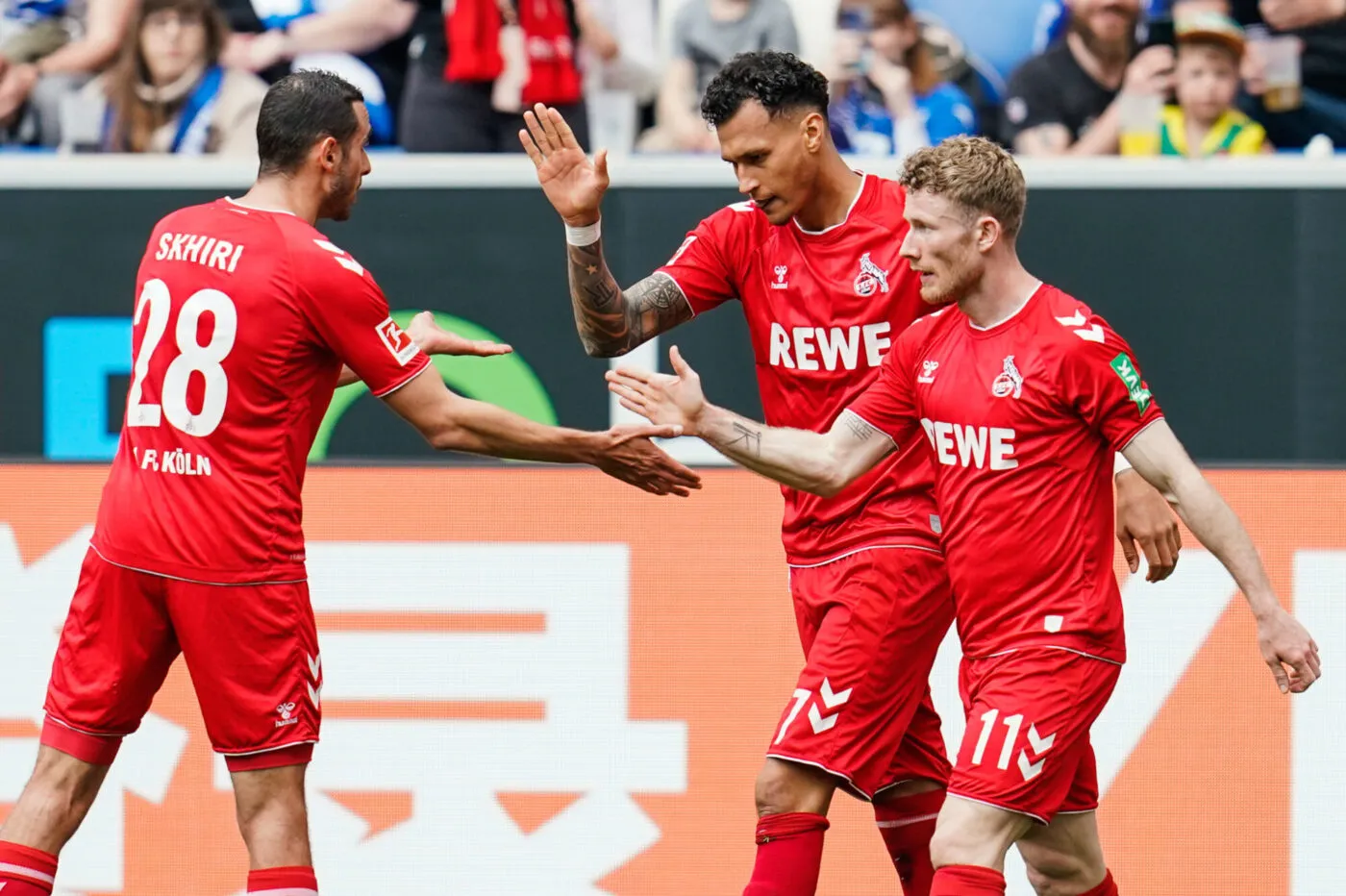 22 April 2023, Baden-Wrttemberg, Sinsheim: Soccer: Bundesliga, TSG 1899 Hoffenheim - 1. FC Kln, Matchday 29, PreZero Arena. Cologne's Ellyes Skhiri (l-r), Cologne's goal scorer Davie Selke and Cologne's Florian Kainz celebrate the goal for 0:2. Photo: Uwe Anspach/dpa - IMPORTANT NOTE: In accordance with the requirements of the DFL Deutsche Fuball Liga and the DFB Deutscher Fuball-Bund, it is prohibited to use or have used photographs taken in the stadium and/or of the match in the form of sequence pictures and/or video-like photo series. - Photo by Icon sport