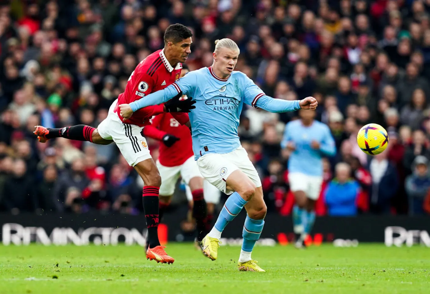Manchester City's Erling Haaland holds off Manchester United's Raphael Varane (left) during the Premier League match at Old Trafford, Manchester. Picture date: Saturday January 14, 2023. - Photo by Icon sport