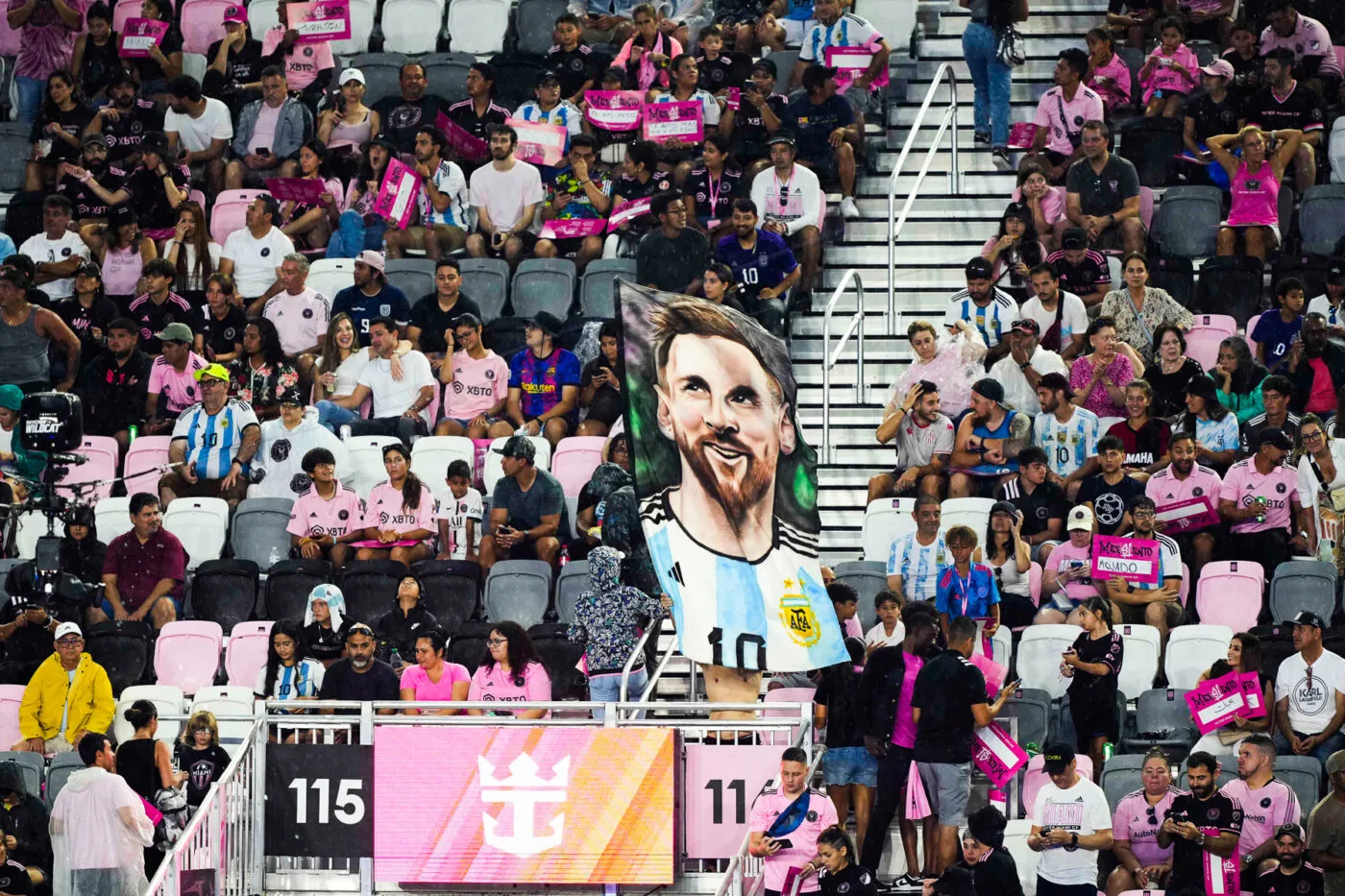 Jul 16, 2023; Ft. Lauderdale, FL, USA; Inter Miami CF fans hold up Lionel Messi signs and banners as he introduced at The Unveil event and press conference at DRV PNK Stadium. Mandatory Credit: Jasen Vinlove-USA TODAY Sports/Sipa USA - Photo by Icon sport