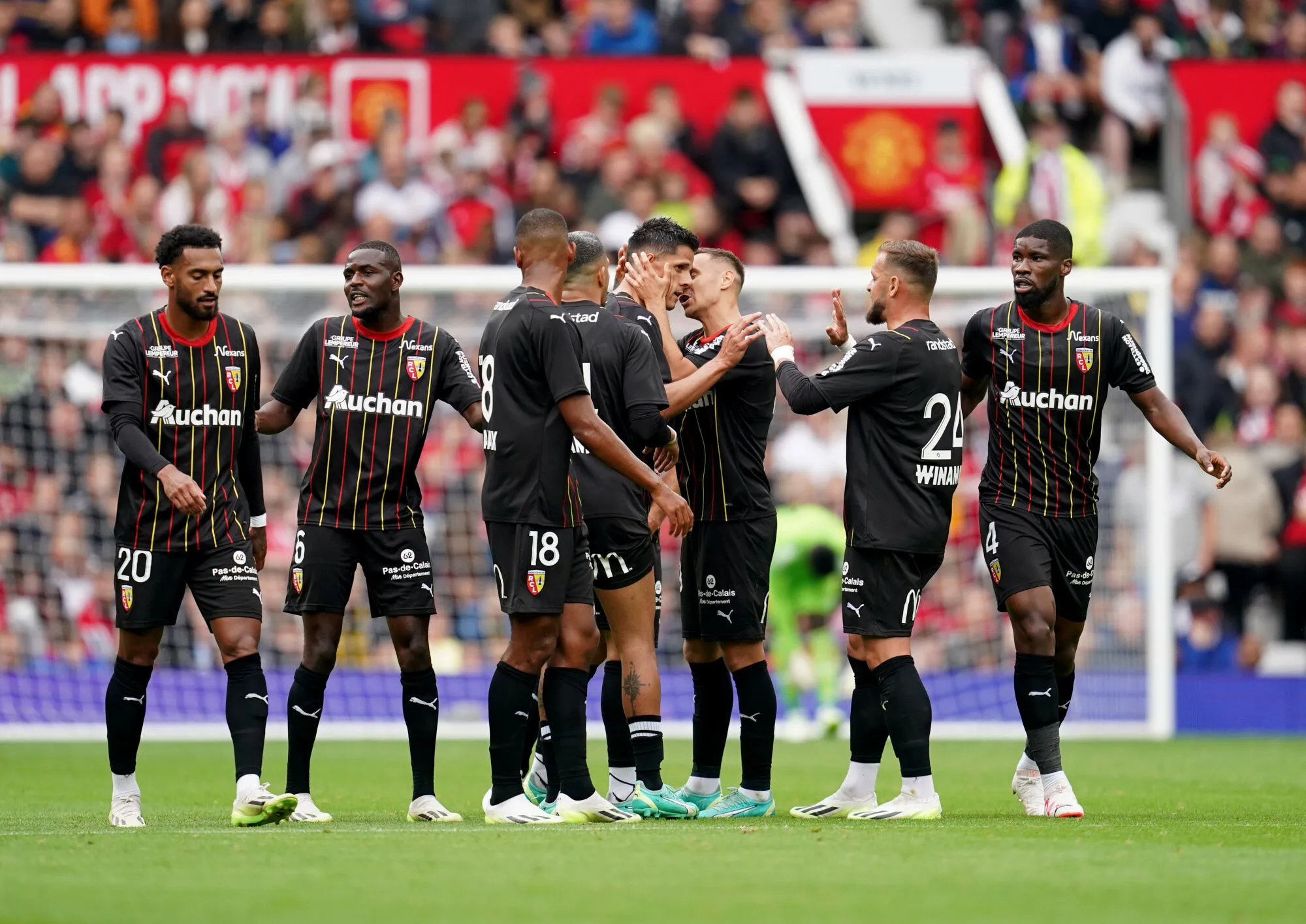RC Lens' Florian Sotoca (fourth right) is congratulated by his team mates after scoring his sides first goal of the game during the pre-season friendly match at Old Trafford, Manchester. Picture date: Saturday August 5, 2023. - Photo by Icon sport