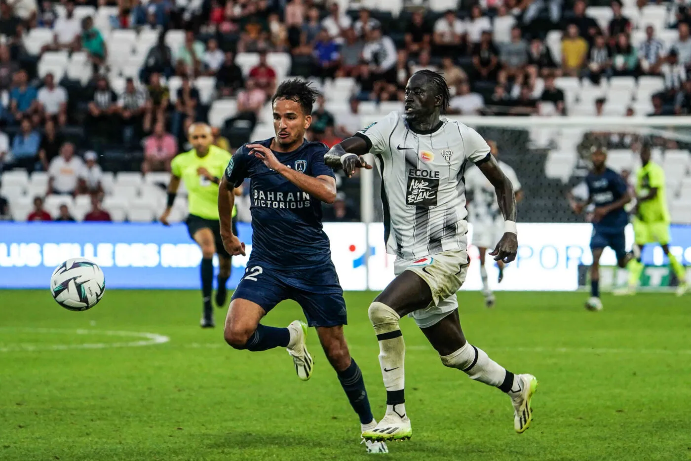 Sofiane ALAKOUCH of Paris FC and Ibrahima NIANE of Angers during the Ligue 2 BKT match between Angers Sporting Club de l'Ouest and Paris Football Club at Stade Raymond Kopa on September 2, 2023 in Angers, France. (Photo by Eddy Lemaistre/Icon Sport)