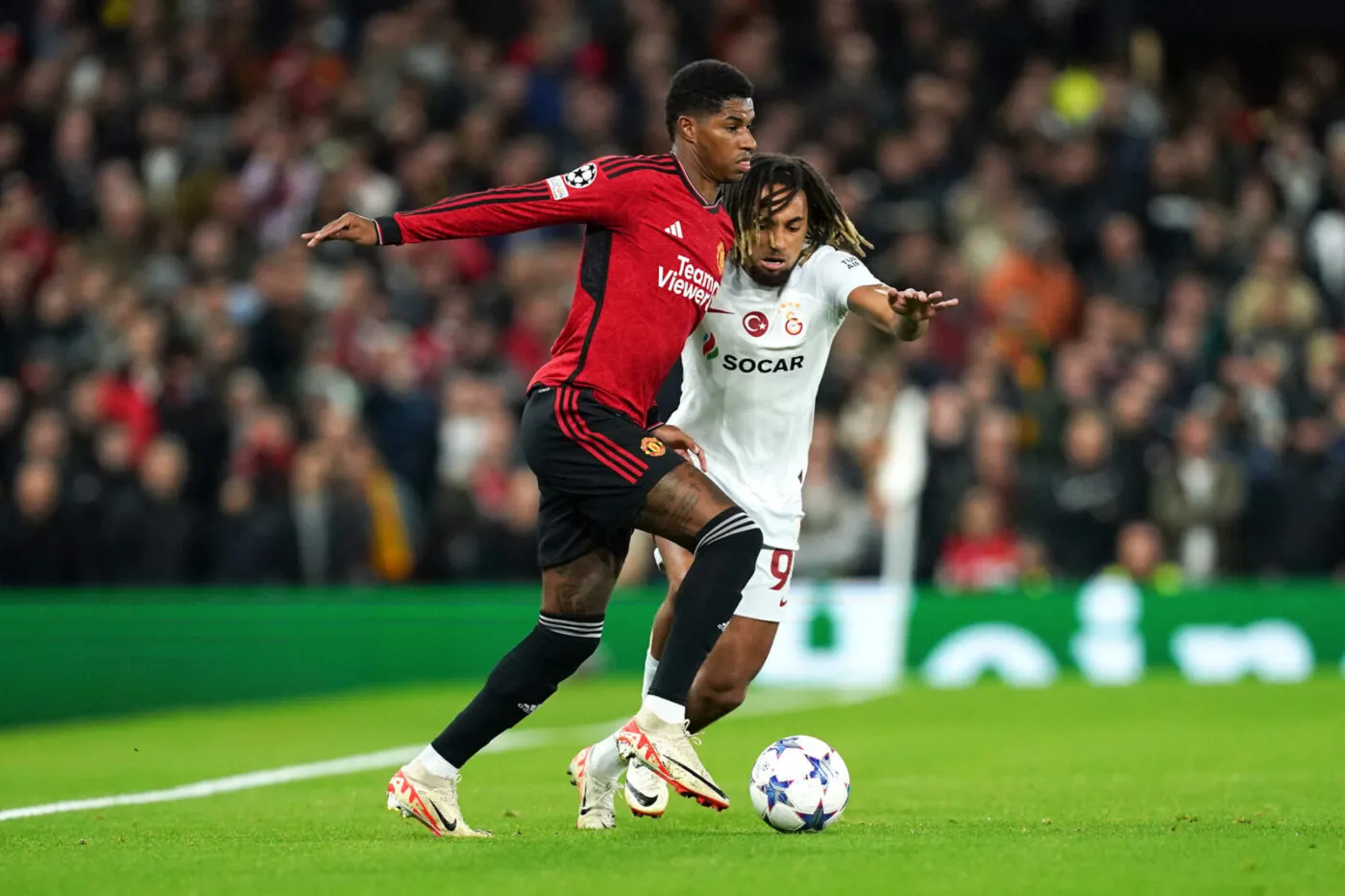 Manchester United's Marcus Rashford (left) and Galatasaray's Sacha Boey battle for the ball during the UEFA Champions League Group A match at Old Trafford, Manchester. Picture date: Tuesday October 3, 2023. - Photo by Icon sport