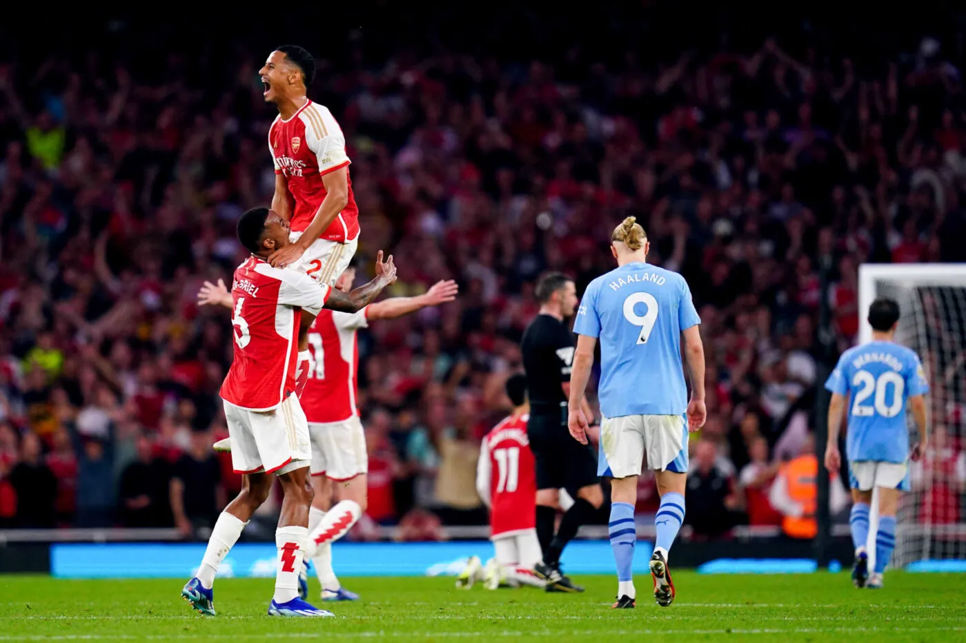 Arsenal's William Saliba (top) and Gabriel celebrate at the end of the Premier League match at the Emirates Stadium, London. Picture date: Sunday October 8, 2023. - Photo by Icon sport