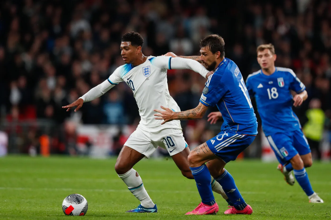 Jude Bellingham of England battles with Francesco Acerbi of Italy during the UEFA Euro 2024 Qualifiers Group C match at Wembley Stadium, London