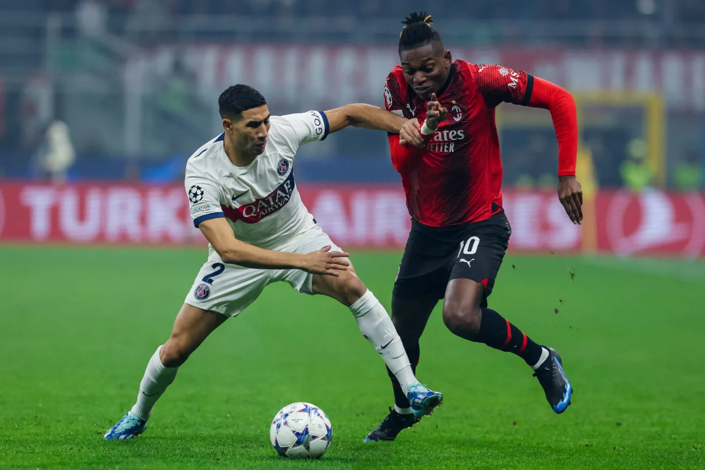 Rafael Leao of AC Milan competes for the ball with Achraf Hakimi of Paris Saint-Germain FC during UEFA Champions League 2023/24 Group Stage - Group F football match between AC Milan and Paris Saint-Germain FC at San Siro Stadium, Milan, Italy on November 07, 2023