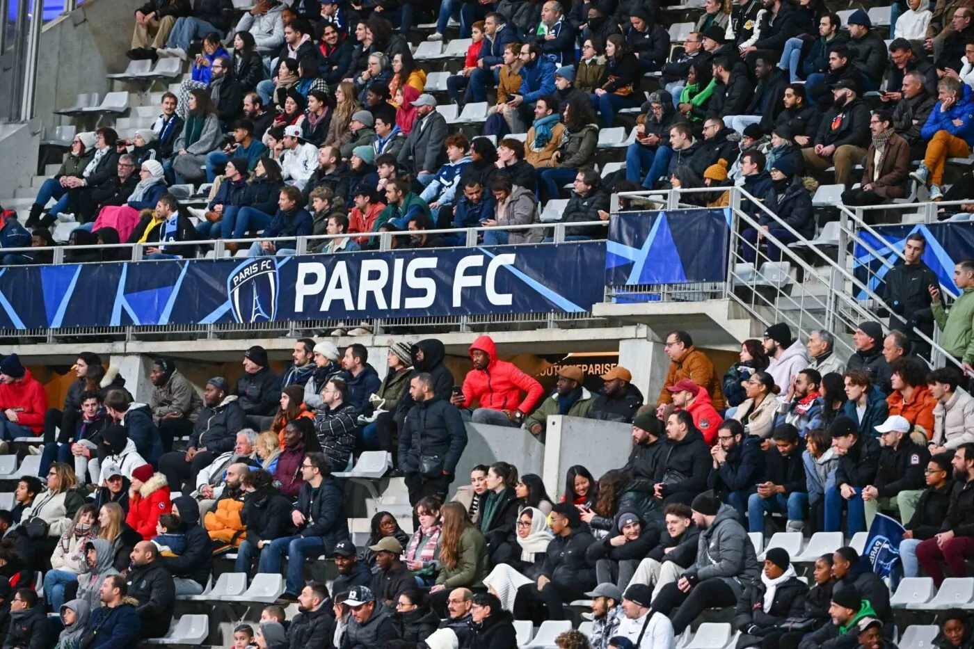 Fans in the stands during the D1 Arkema match between Paris Football Club and Football Club des Girondins de Bordeaux at Stade Charlety on November 19, 2023 in Paris, France. (Photo by Anthony Dibon/Icon Sport)