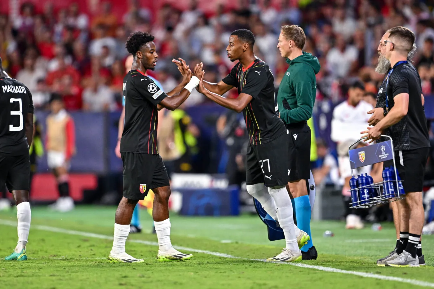 Sepe WAHI of Lens and Morgan GUILAVOGUI of Lens during the UEFA Champions League Group B football match between Sevilla Futbol Club and Racing Club de Lens at Estadio Ramon Sanchez Pizjuan on September 20, 2023 in Seville, Spain. (Photo by Baptiste Fernandez/Icon Sport)