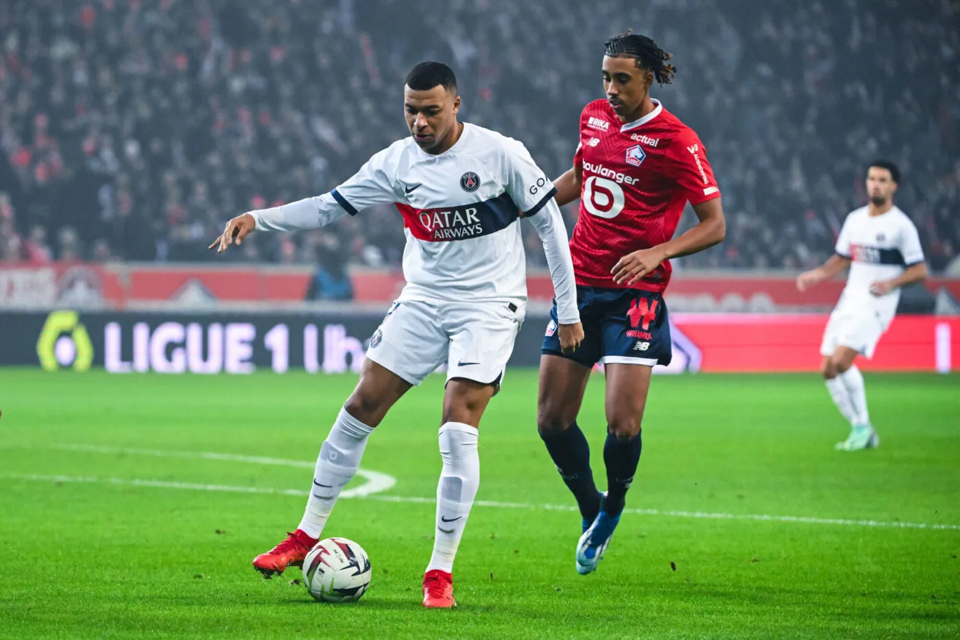 Kylian MBAPPE of Paris SG and Leny YORO of Lille during the Ligue 1 Uber Eats match between LOSC Lille and Paris Saint-Germain Football Club at Stade Pierre Mauroy on December 17, 2023 in Lille, France. (Photo by Anthony Dibon/Icon Sport)