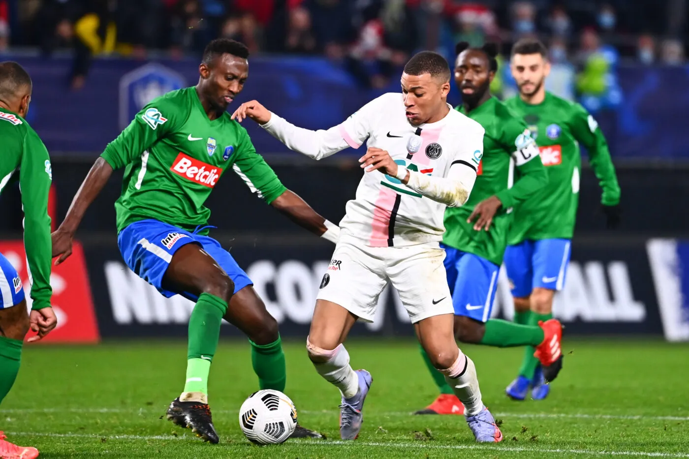 Kylian MBAPPE of PSG and Yann KOUADIO of Feignies during the French Cup match between Entente Feignies-Aulnoye and Paris Saint-Germain on December 19, 2021 in Feignies, France. (Photo by Anthony Dibon/Icon Sport)