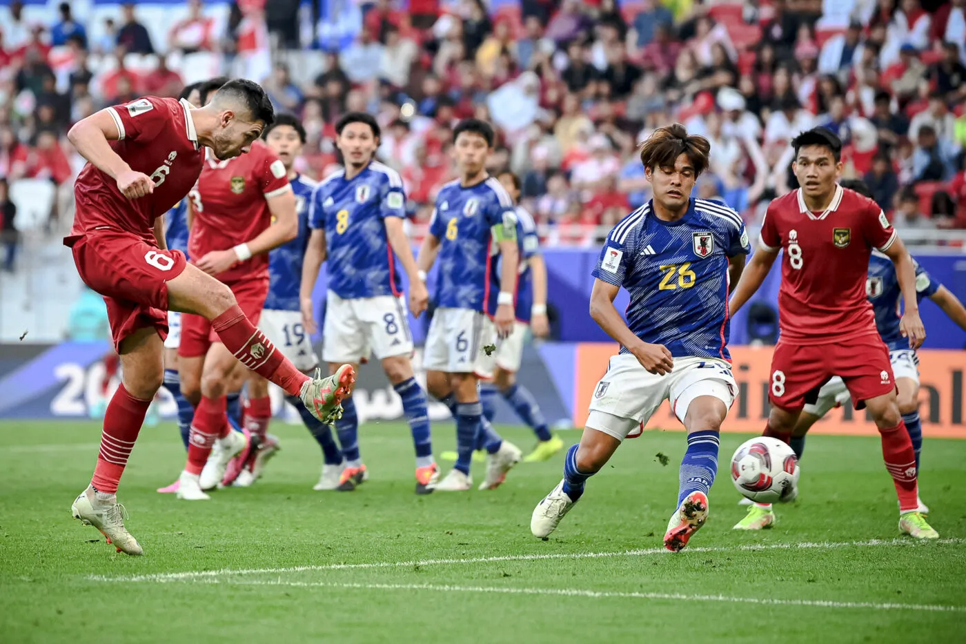 (240124) -- DOHA, Jan. 24, 2024 (Xinhua) -- Sandy Walsh (Front L) of Indonesia shoots to score during the Group D match between Japan and Indonesia at AFC Asian Cup Qatar 2023 at Al Thumama Stadium in Doha, Qatar, Jan. 24 2024. (Xinhua/Jiang Han) - Photo by Icon Sport