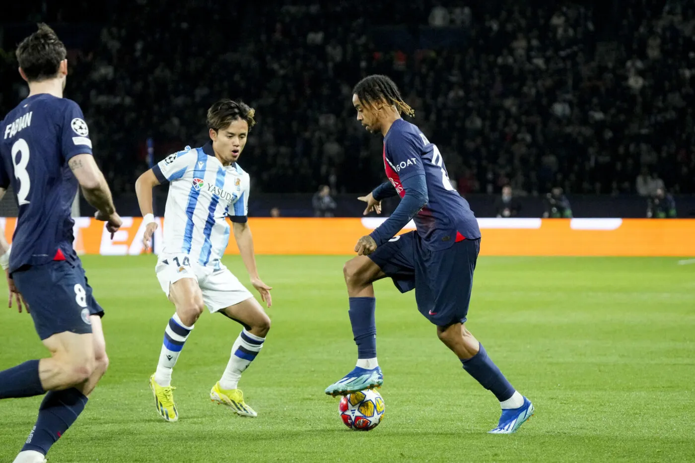 Takefusa KUBO of Real Sociedad and Bradley BARCOLA of PSG during the UEFA Champions League match between Paris Saint-Germain and Real Sociedad de Football at Parc des Princes on February 14, 2024 in Paris, France. (Photo by Hugo Pfeiffer/Icon Sport)
