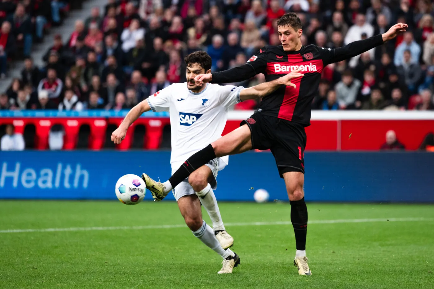 30 March 2024, North Rhine-Westphalia, Leverkusen: Soccer: Bundesliga, Bayer Leverkusen - TSG 1899 Hoffenheim, Matchday 27, BayArena. Leverkusen's Patrik Schick (r) and Hoffenheim's Ozan Kabak fight for the ball. Photo: Marius Becker/dpa - IMPORTANT NOTE: In accordance with the regulations of the DFL German Football League and the DFB German Football Association, it is prohibited to utilize or have utilized photographs taken in the stadium and/or of the match in the form of sequential images and/or video-like photo series. Photo by Icon sport   - Photo by Icon Sport