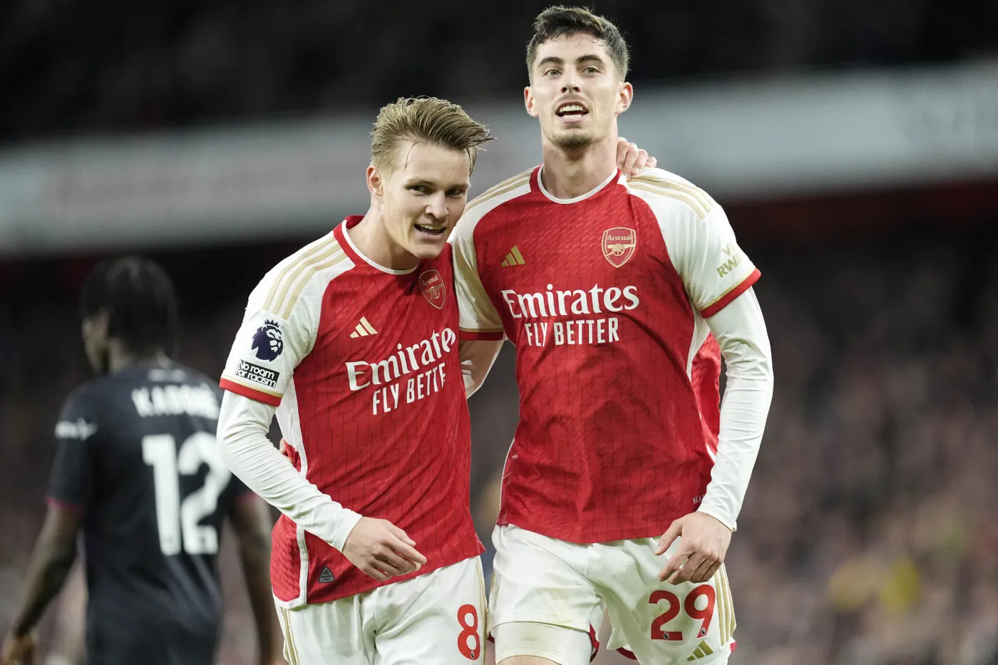 Arsenal's Martin Odegaard (left) celebrates after scoring the opening goal of the game with team-mate Kai Havertz during the Premier League match at the Emirates Stadium, London. Picture date: Wednesday April 3, 2024.   - Photo by Icon Sport