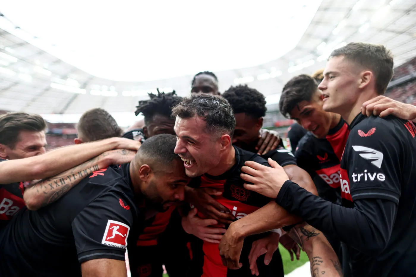 dpatop - 14 April 2024, North Rhine-Westphalia, Leverkusen: Soccer: Bundesliga, Bayer 04 Leverkusen - SV Werder Bremen, Matchday 29, BayArena. Leverkusen's Granit Xhaka (M) is cheered by his teammates after his goal to make it 2-0. IMPORTANT NOTE: In accordance with the regulations of the DFL German Football League and the DFB German Football Association, it is prohibited to exploit or have exploited photographs taken in the stadium and/or of the match in the form of sequential images and/or video-like photo series. Photo: Rolf Vennenbernd/dpa Photo by Icon Sport   - Photo by Icon Sport