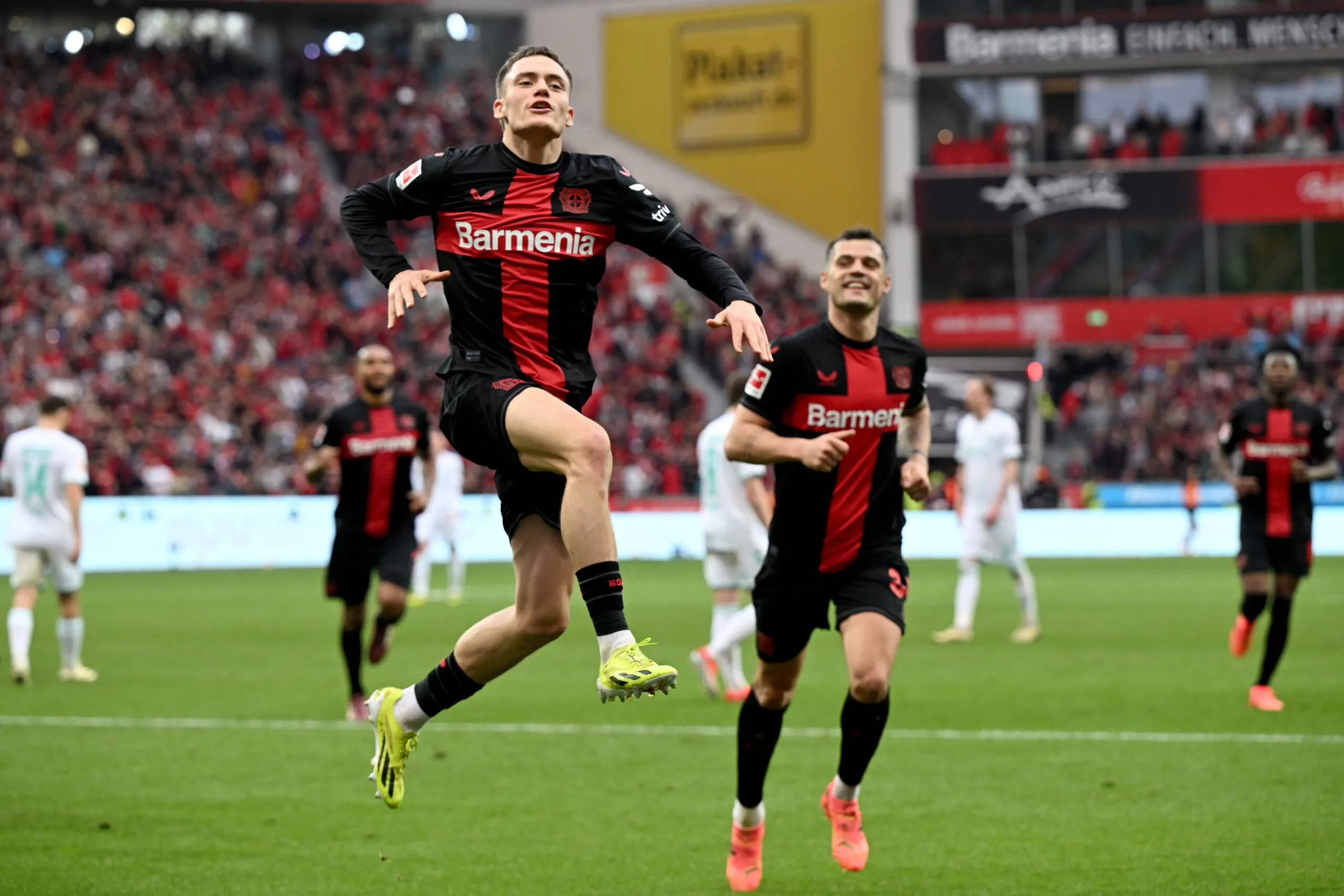 dpatop - 14 April 2024, North Rhine-Westphalia, Leverkusen: Soccer, Bundesliga, Bayer 04 Leverkusen - SV Werder Bremen, Matchday 29, BayArena. Leverkusen's Florian Wirtz (front) celebrates his goal to make it 3-0. IMPORTANT NOTE: In accordance with the regulations of the DFL German Football League and the DFB German Football Association, it is prohibited to use or have used photographs taken in the stadium and/or of the match in the form of sequential images and/or video-like photo series. Photo: Federico Gambarini/dpa Photo by Icon Sport   - Photo by Icon Sport
