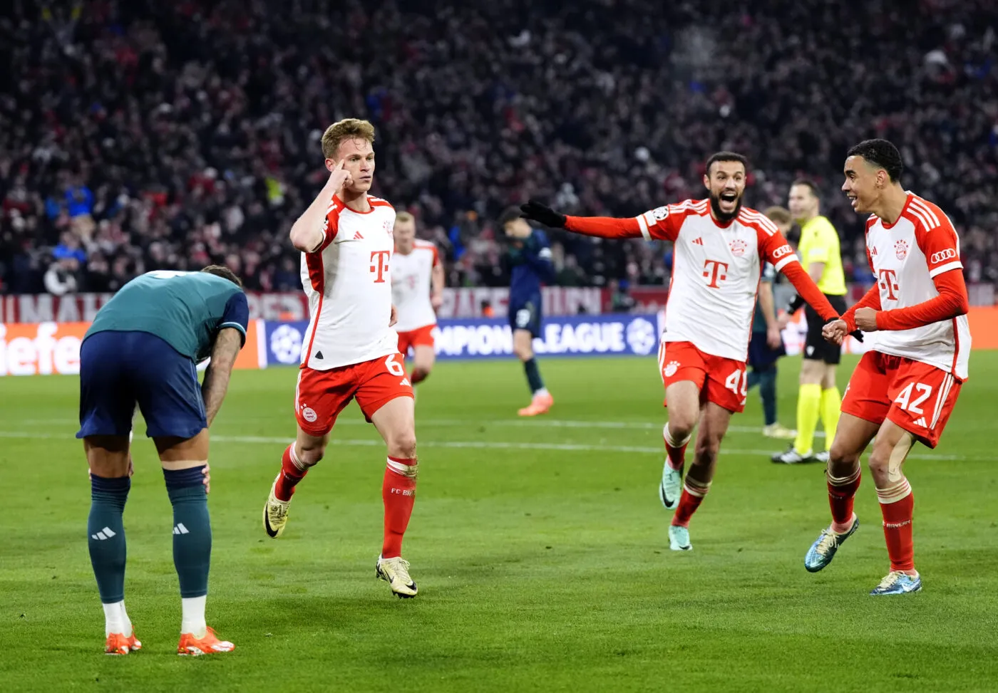 Bayern Munich's Joshua Kimmich (second left) celebrates scoring their side's first goal of the game during the UEFA Champions League quarter-final, second leg match at the Allianz Arena, Munich. Picture date: Wednesday April 17, 2024.   - Photo by Icon Sport