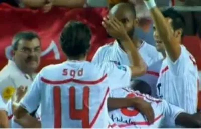 Escudé en version texto