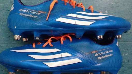 Photo : Podolski soutient Schumi